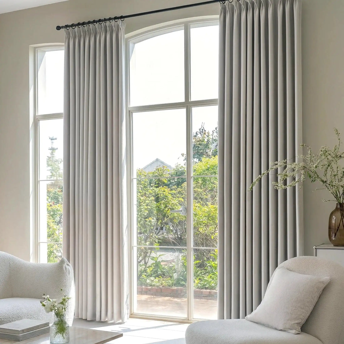Deep pinch pleat Light Gray John Linen Texture Cotton Curtains on black ring rods dressing a high arched door