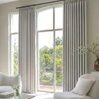 Deep pinch pleat Light Gray John Linen Texture Cotton Curtains on black ring rods dressing a high arched door