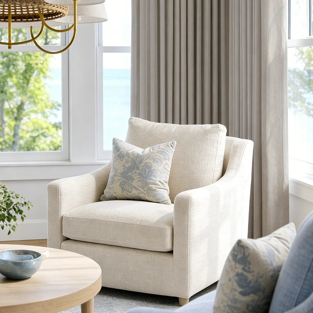 Cream fabric accent chair positioned beside the soft drape structure of Pearl Gray John Linen Texture Cotton Curtains