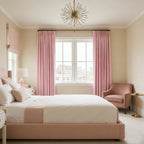 Tailored pinch pleat panels of Pink John Linen Texture Cotton Curtains frame a bright city view bedroom window