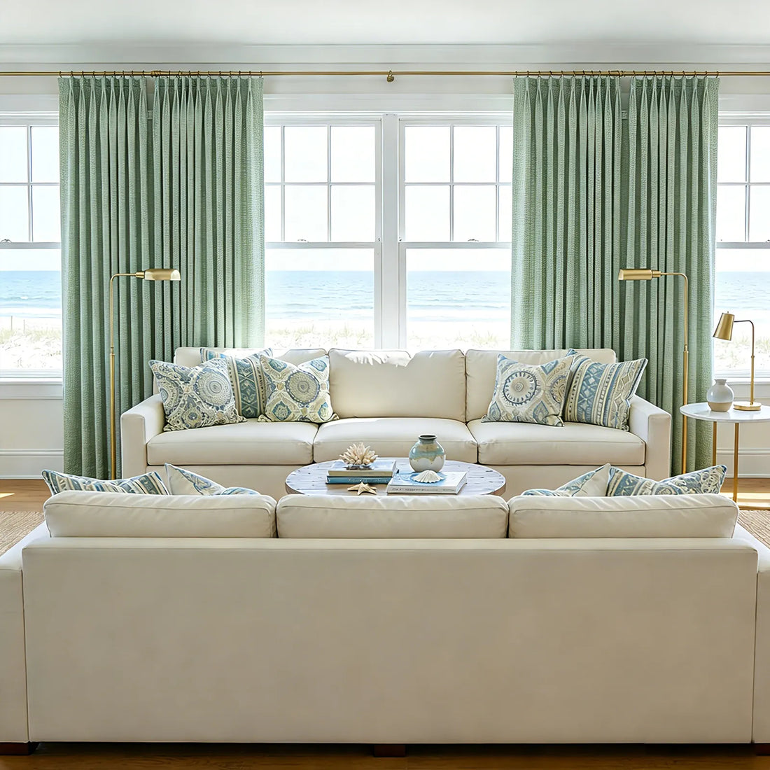 Ocean view lounge room featuring symmetric layouts of Grass Green John Linen Texture Cotton Curtains behind neutral couches
