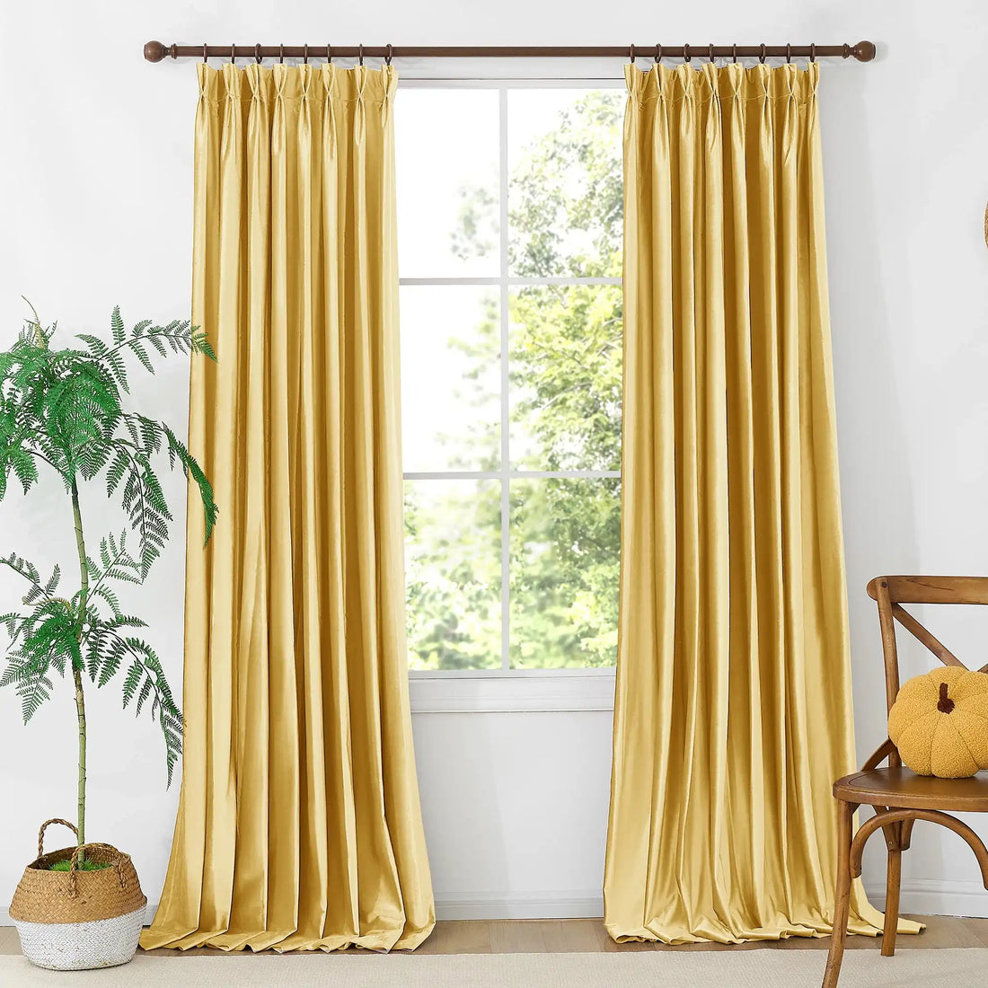 Modern living room with yellow velvet curtains, large window, ceiling fan, beige walls, and comfortable seating, home interior