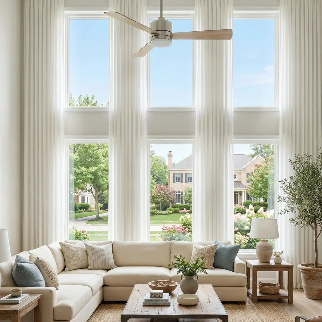 Elegant floor to ceiling White Lisa Semi Sheer Curtains creating a bright and airy modern living room