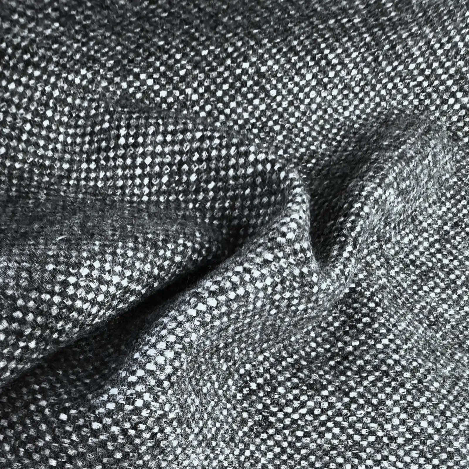 A flat, full-frame macro shot highlighting the uniform and tight basketweave pattern of the curtain fabric, composed of a precise, repeating grid of charcoal gray and white yarns.
