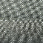 A close-up, full-frame shot of the forest green fabric showing a soft horizontal ridge or fold across the center. The detailed basketweave pattern reveals a tight, intricate mix of dark green, sage, and off-white threads.