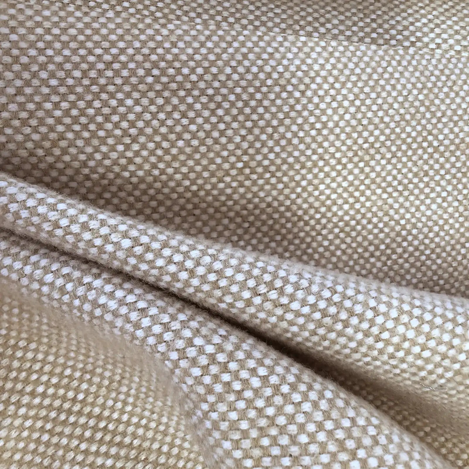 A detailed macro shot of the heathered light yellow and white curtain fabric cascading into heavy, deep folds, emphasizing the material's premium weight, flexibility, and thick, high-quality weave.