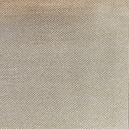 A close-up shot focusing on a light yellow-tan curtain panel hanging in crisp, neat vertical pleats. The fabric's subtle textured pattern is highlighted against a bright white window frame in the background.