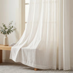 Soft light filtering White Sarah Semi Sheer Curtains draping elegantly over a wooden bench