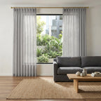 Minimalist living room featuring ripple fold Gray Sheila Cotton Semi Sheer Curtains styled with a dark gray sofa