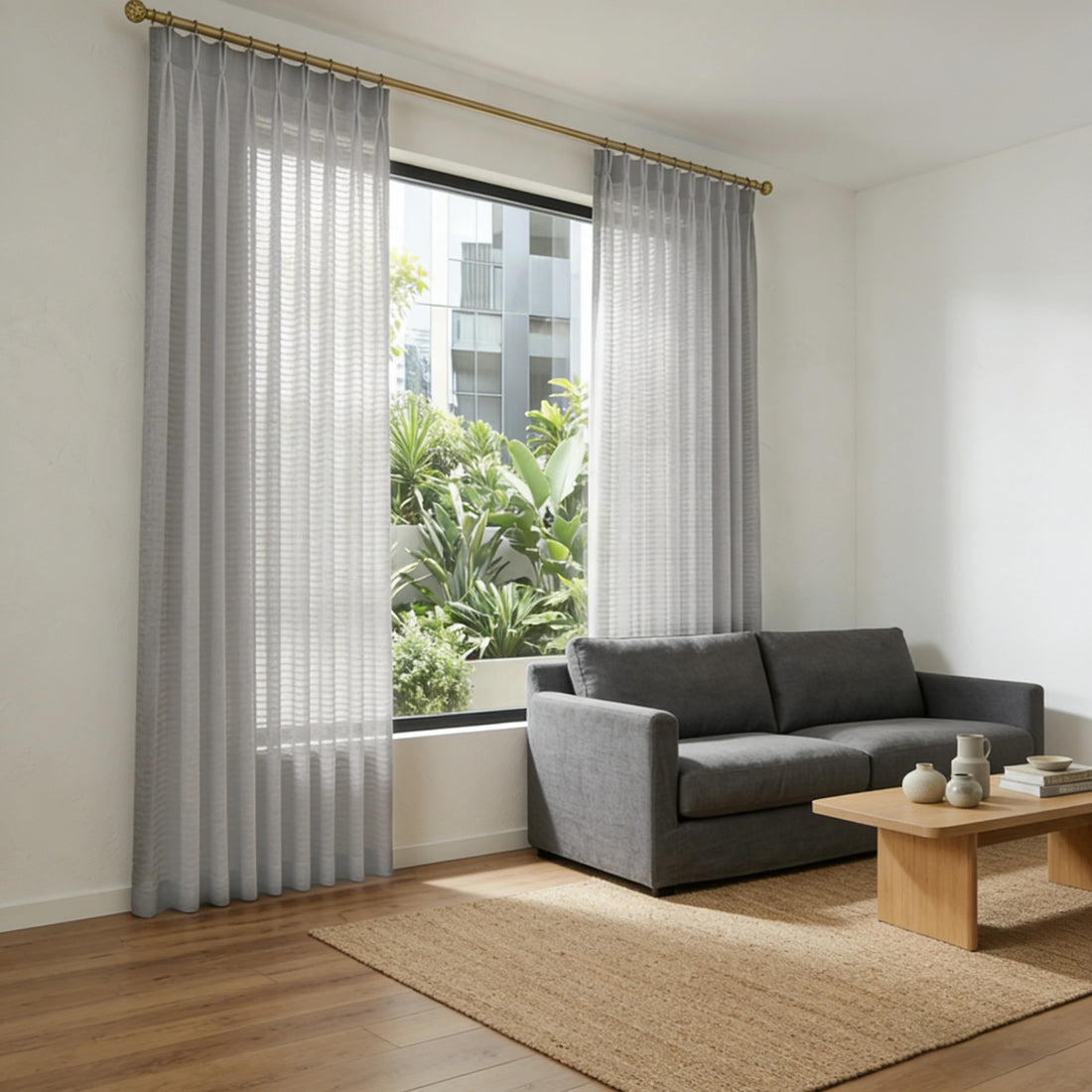 Sunlit modern lounge displaying the elegant drapery and texture of Gray Sheila Cotton Semi Sheer Curtains