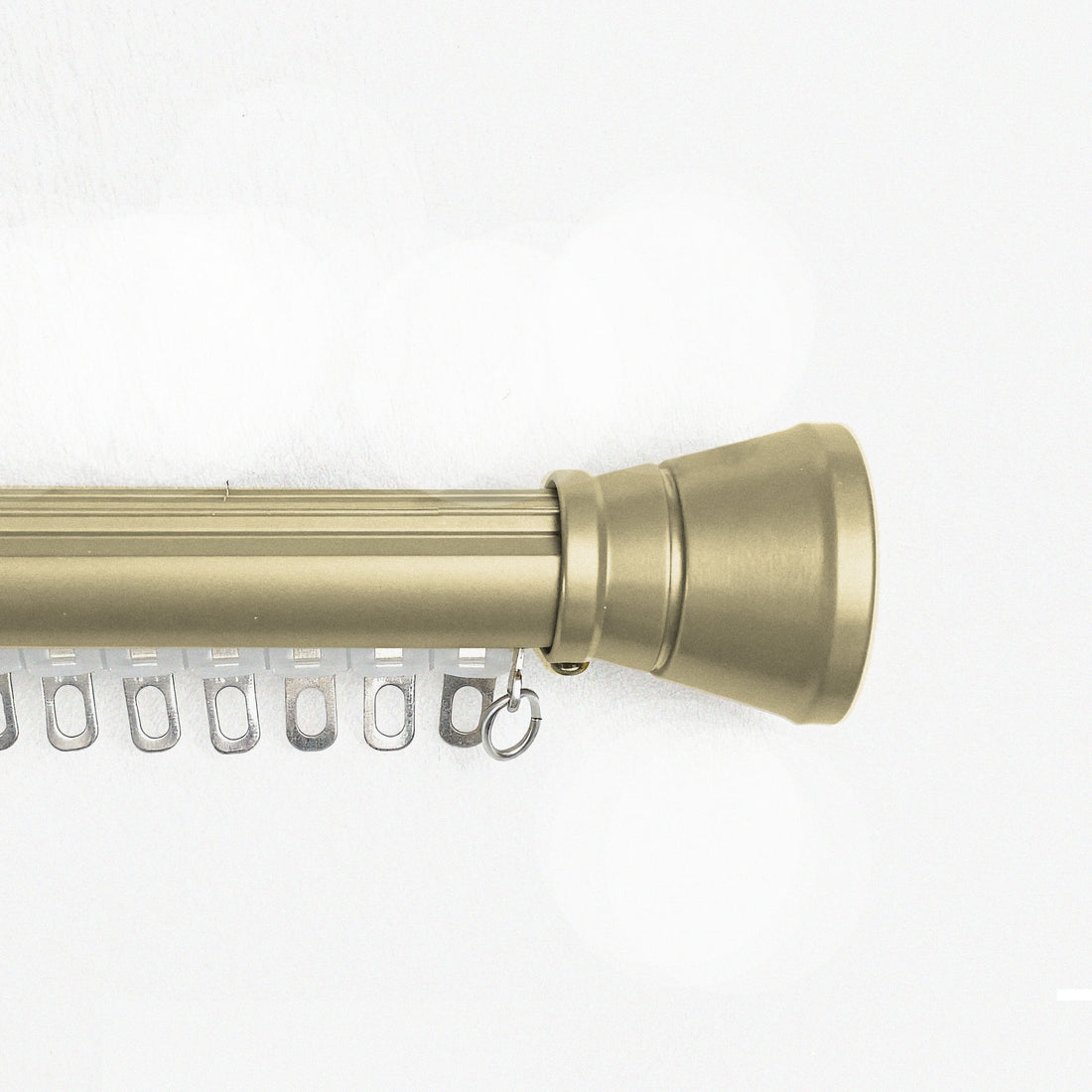 Tagore gold custom curtain rod with conical finials and flat track