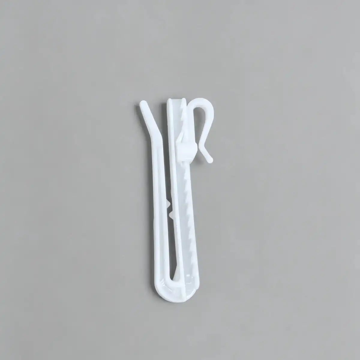 Set of 20 white plastic Zoe curtain hooks with adjustable height, designed for securing curtains on rods, ideal for home decor.