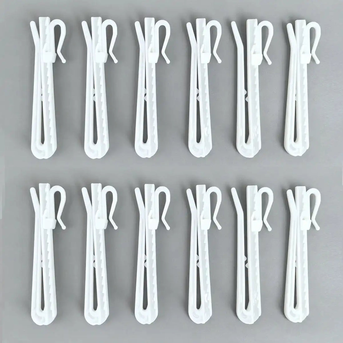 Detailed view of Zoe curtain hooks showing the hook mechanism with labels indicating 'Up' and 'Down' for height adjustment, set of 20.