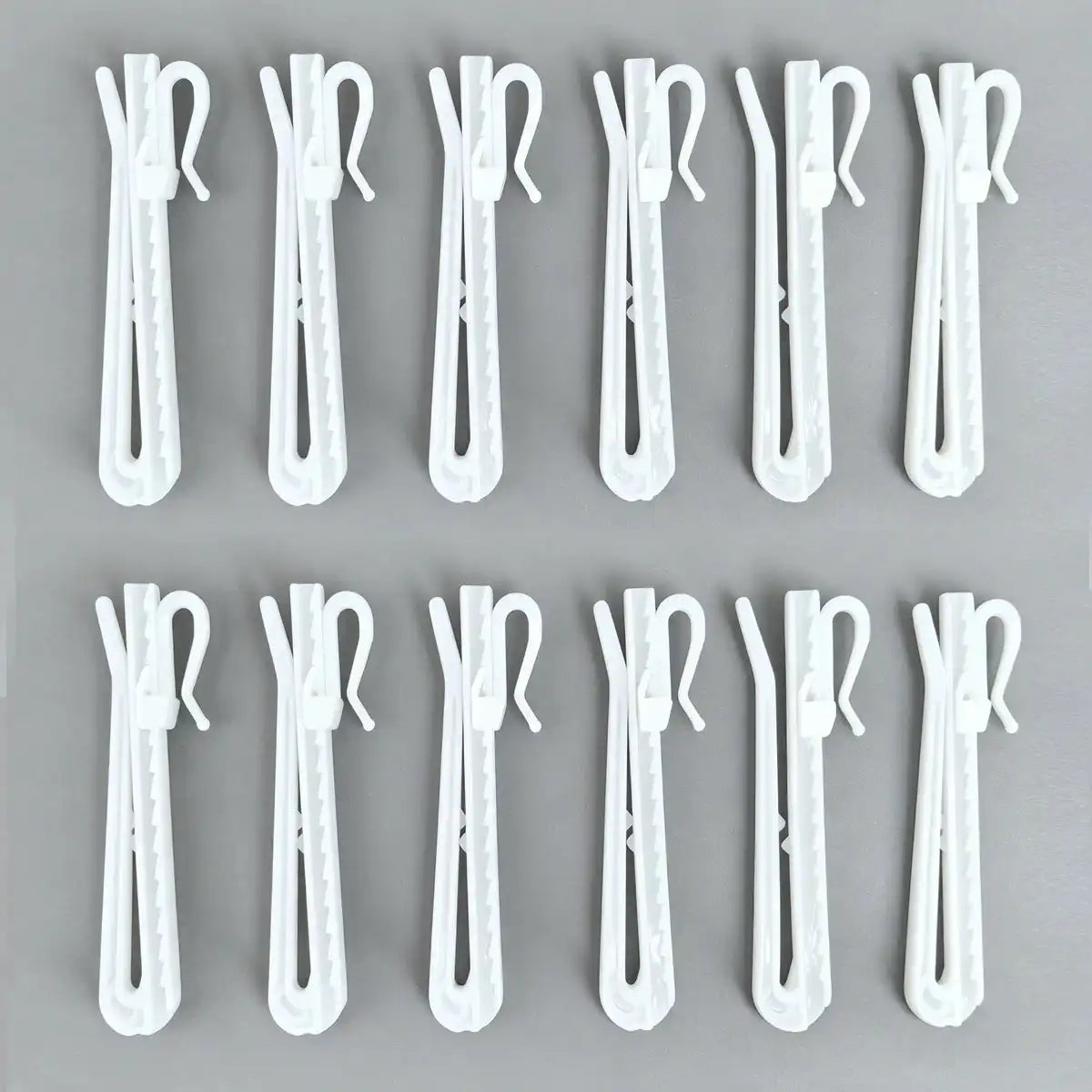 Detailed view of Zoe curtain hooks showing the hook mechanism with labels indicating 'Up' and 'Down' for height adjustment, set of 20.