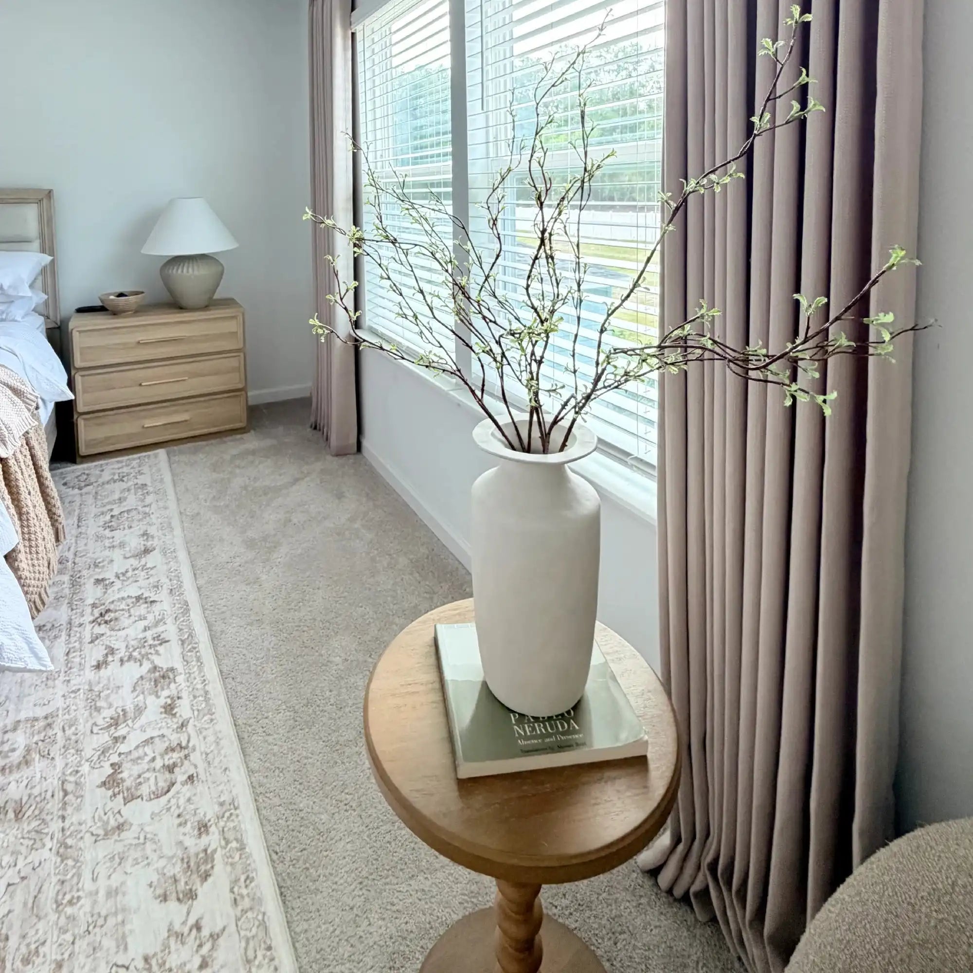 Decorative white vase on a rustic table set against the luxury drape of Light Brown John Linen Texture Cotton Curtains