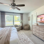 Spacious primary bedroom staging with Light Brown John Linen Texture Cotton Curtains framing windows beside a dresser