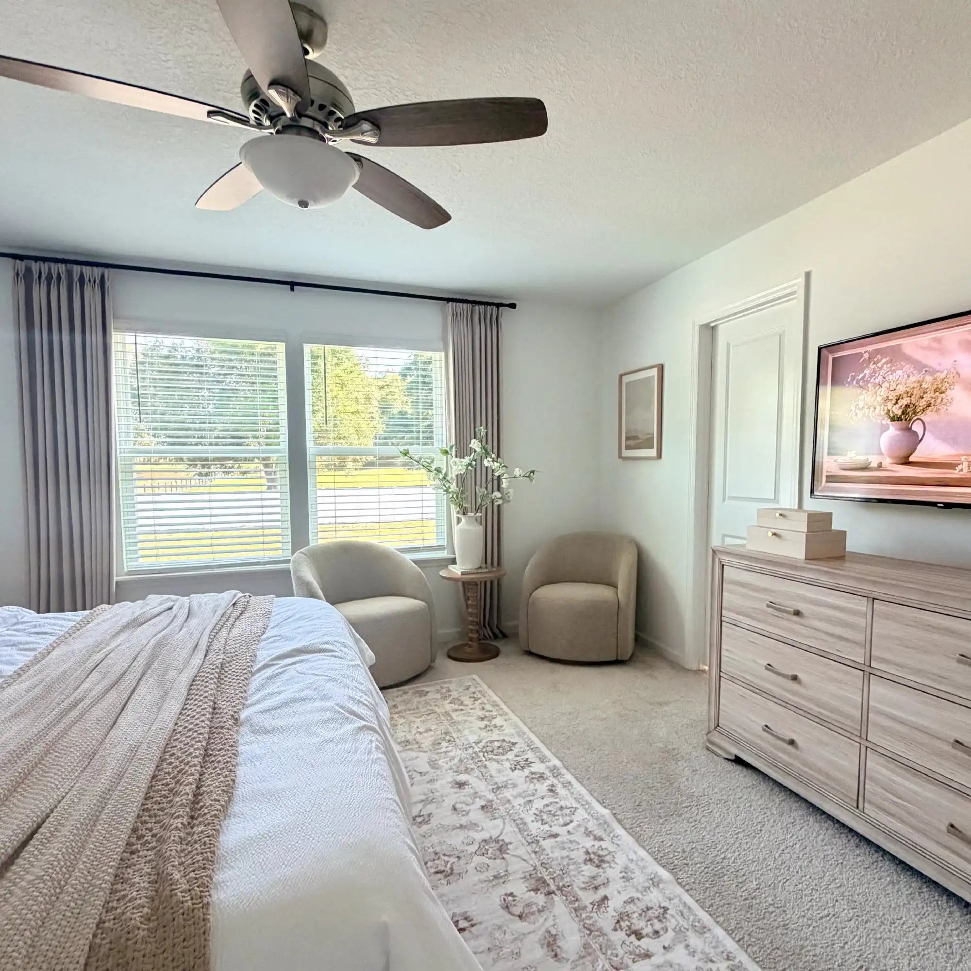 Spacious primary bedroom staging with Light Brown John Linen Texture Cotton Curtains framing windows beside a dresser