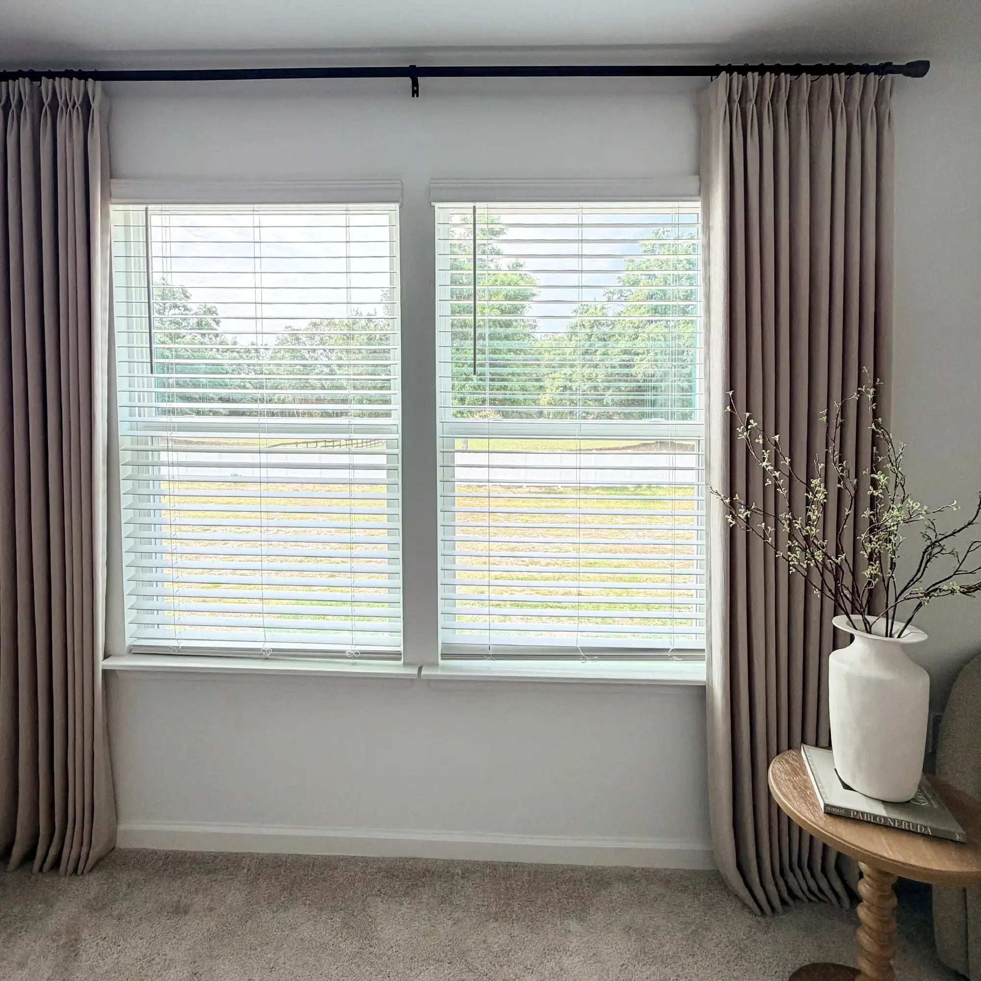 Light Brown John Linen Texture Cotton Curtains styled around white blinds with a ceramic vase on a side table