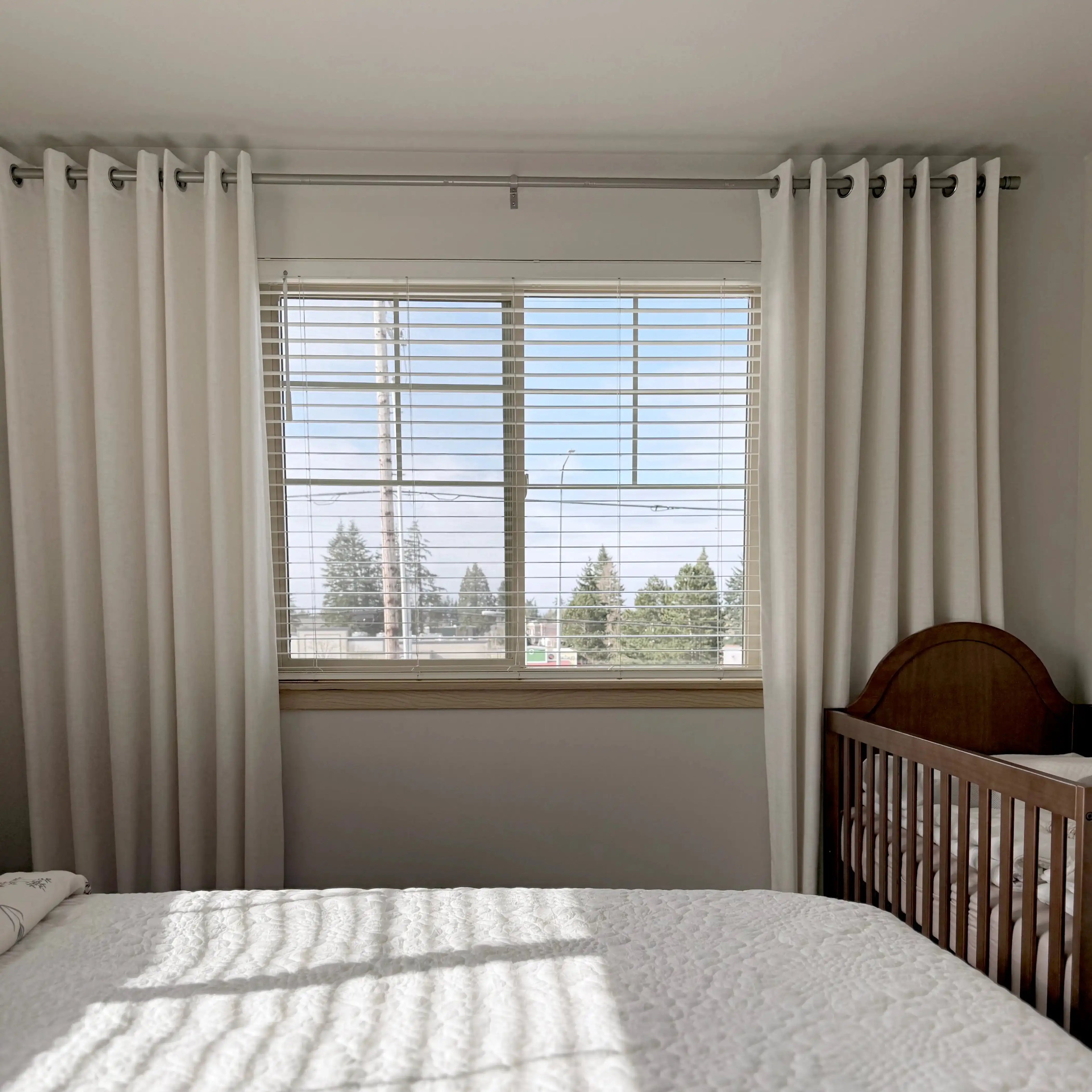 Grommet top Plaid White Jasper Dotted Linen Blend Curtains on bedroom window, cozy nursery room setup