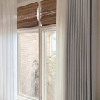 Light Gray John Linen Texture Cotton Curtains layered with white sheer panels and bamboo shades