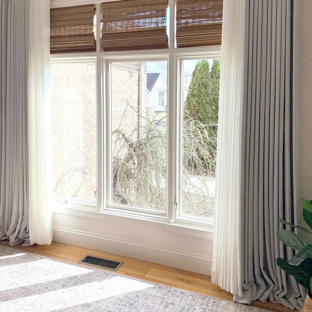 Floor length Light Gray John Linen Texture Cotton Curtains framing a bright sunlit window in a modern home