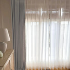 Elegant pinch pleats of Light Gray John Linen Texture Cotton Curtains paired with translucent white sheers