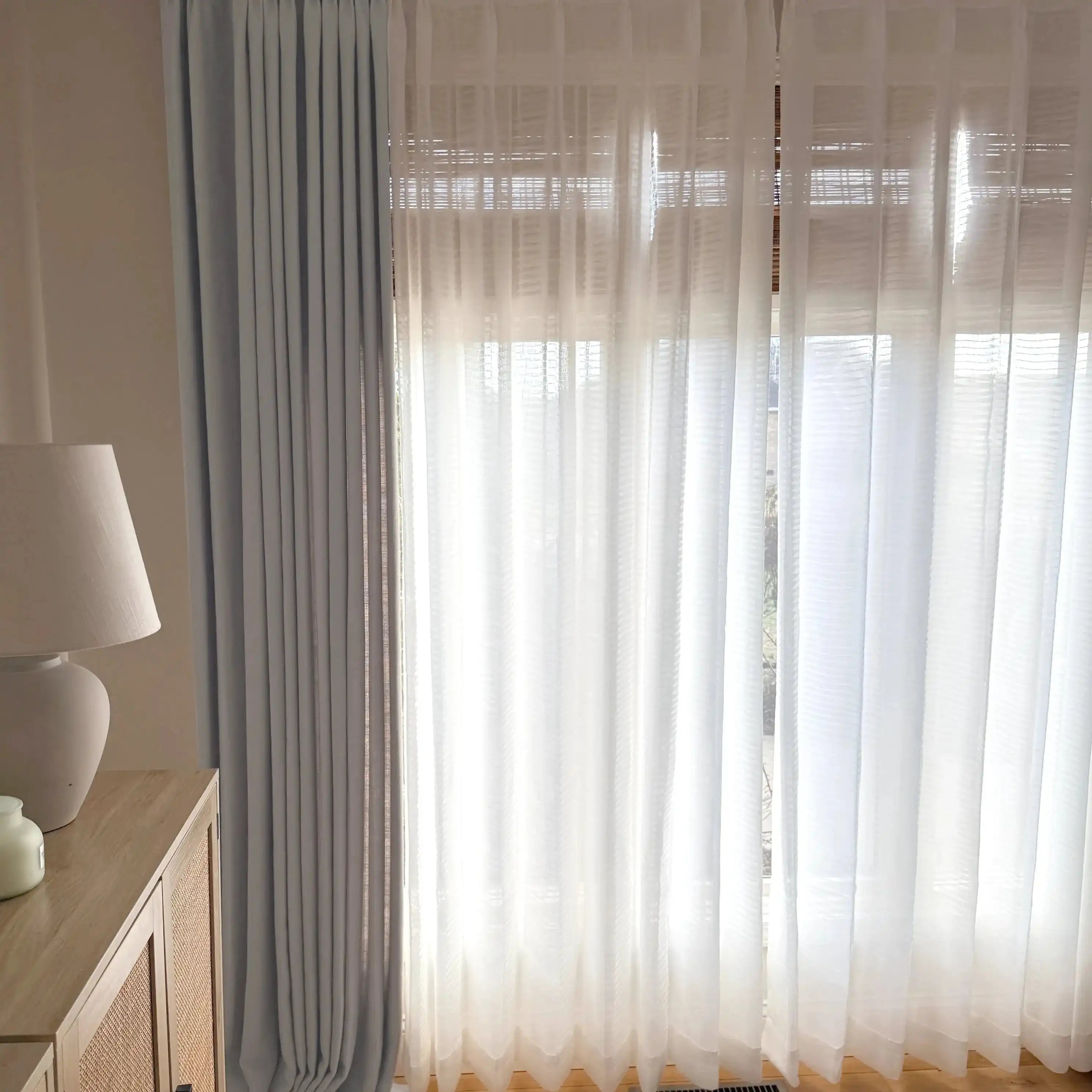 Elegant pinch pleats of Light Gray John Linen Texture Cotton Curtains paired with translucent white sheers