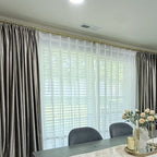 Elegant beige velvet curtains with gold curtain rod in a modern dining room, light filtering through sheer white curtains, SKU: AGB21-15