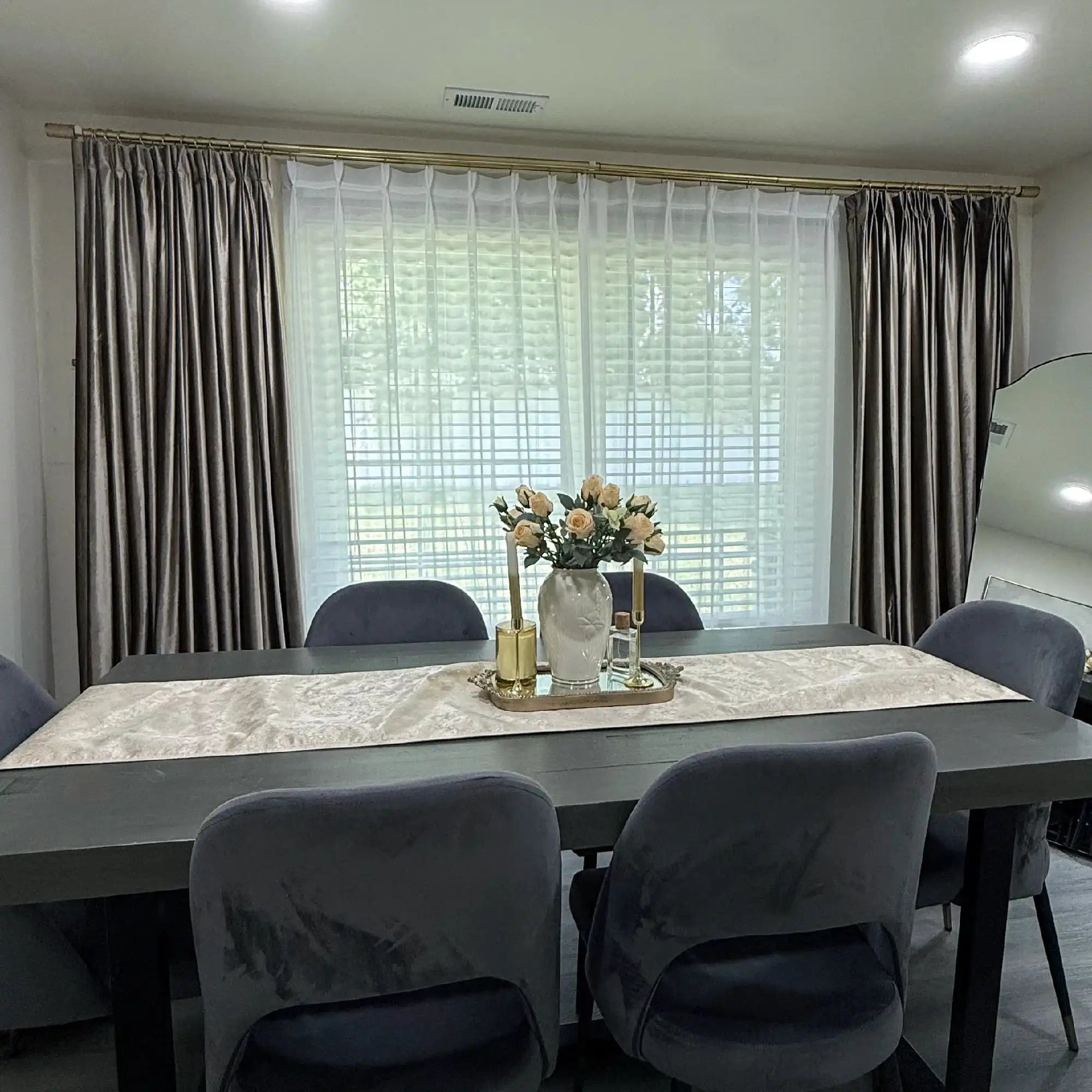 Room with beige velvet curtains and sheer white drapes, window view, stylish home interior, soft lighting