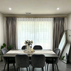 Pinch pleat White Lisa Semi Sheer Curtains paired with luxury drapes in a sophisticated dining room setup