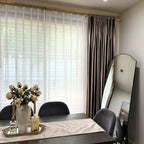 Stylish dining room corner revealing the impeccable pleating and drapery of White Lisa Semi Sheer Curtains