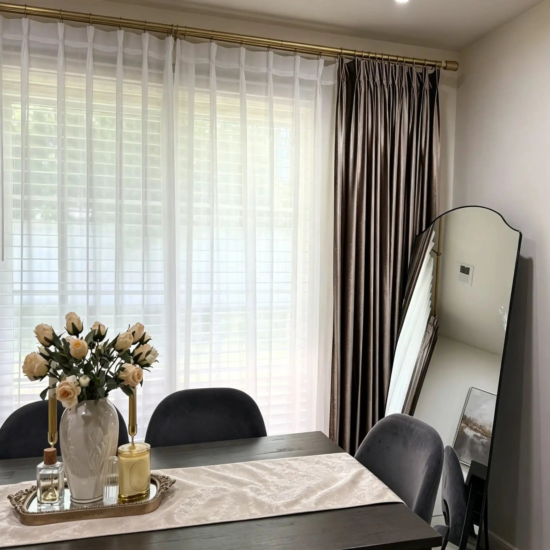 Stylish dining room corner revealing the impeccable pleating and drapery of White Lisa Semi Sheer Curtains